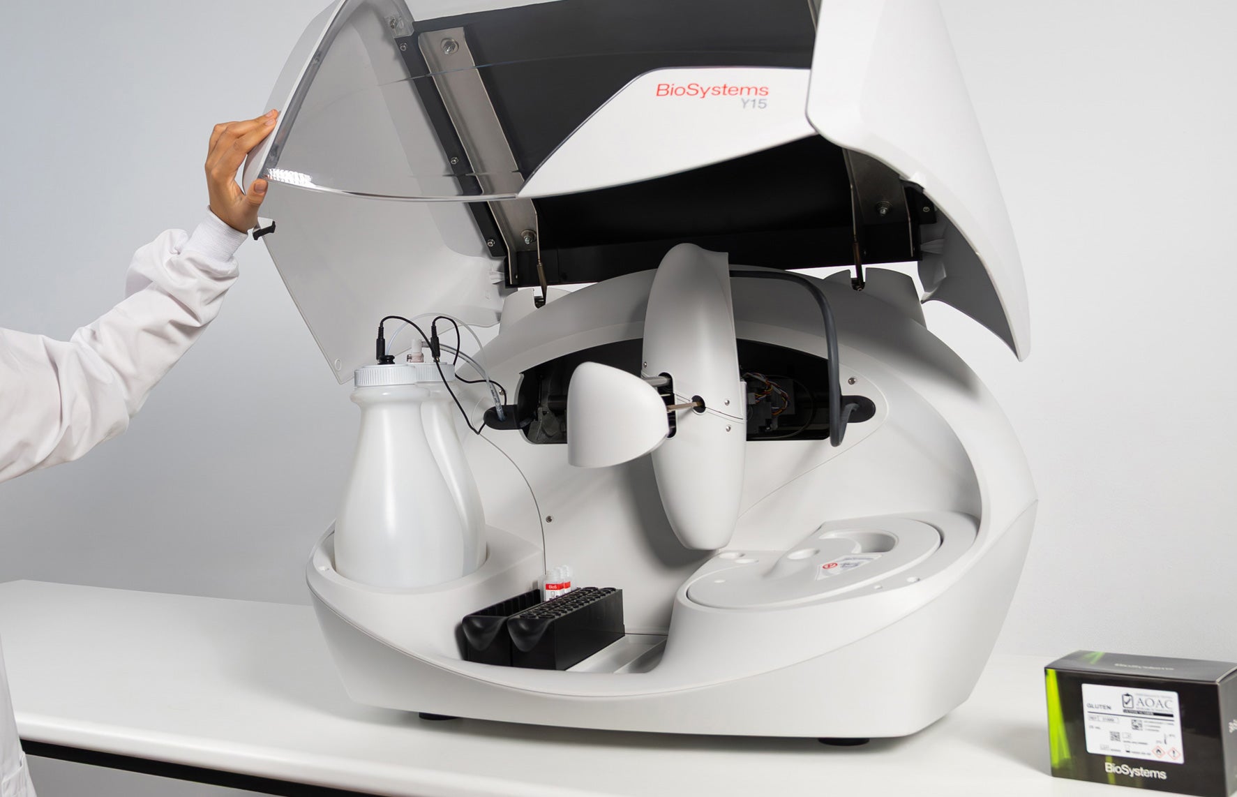 Person interacting with a white and black device labeled 'Biologym' on a gray background